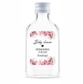 Prezent na baby shower, pamiątka z baby shower buteleczka z kwiatowa naklejką